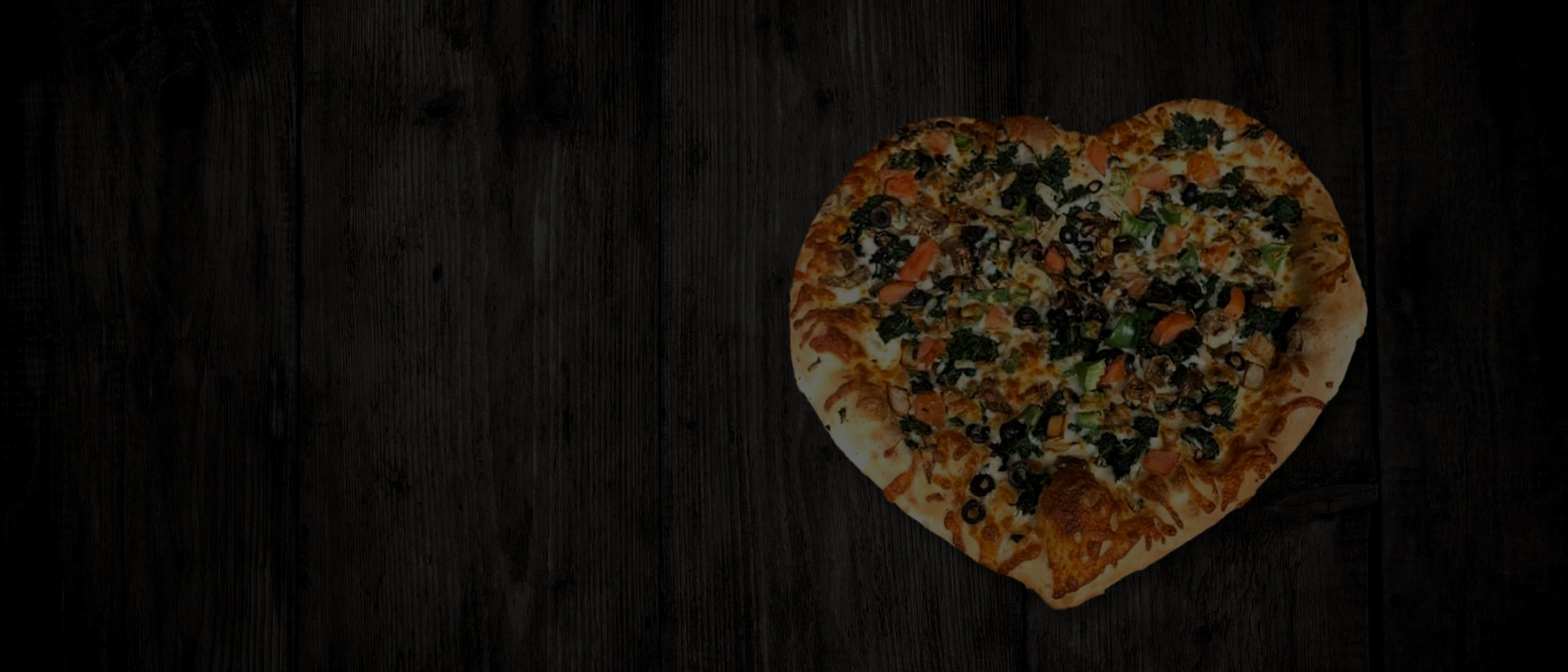 Hearth pizza with black olives on wooden background